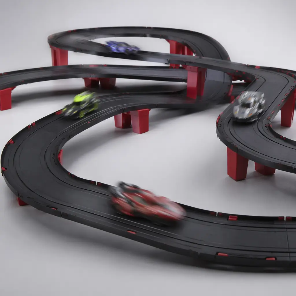 App-controlled toy racing track with small smart cars in motion