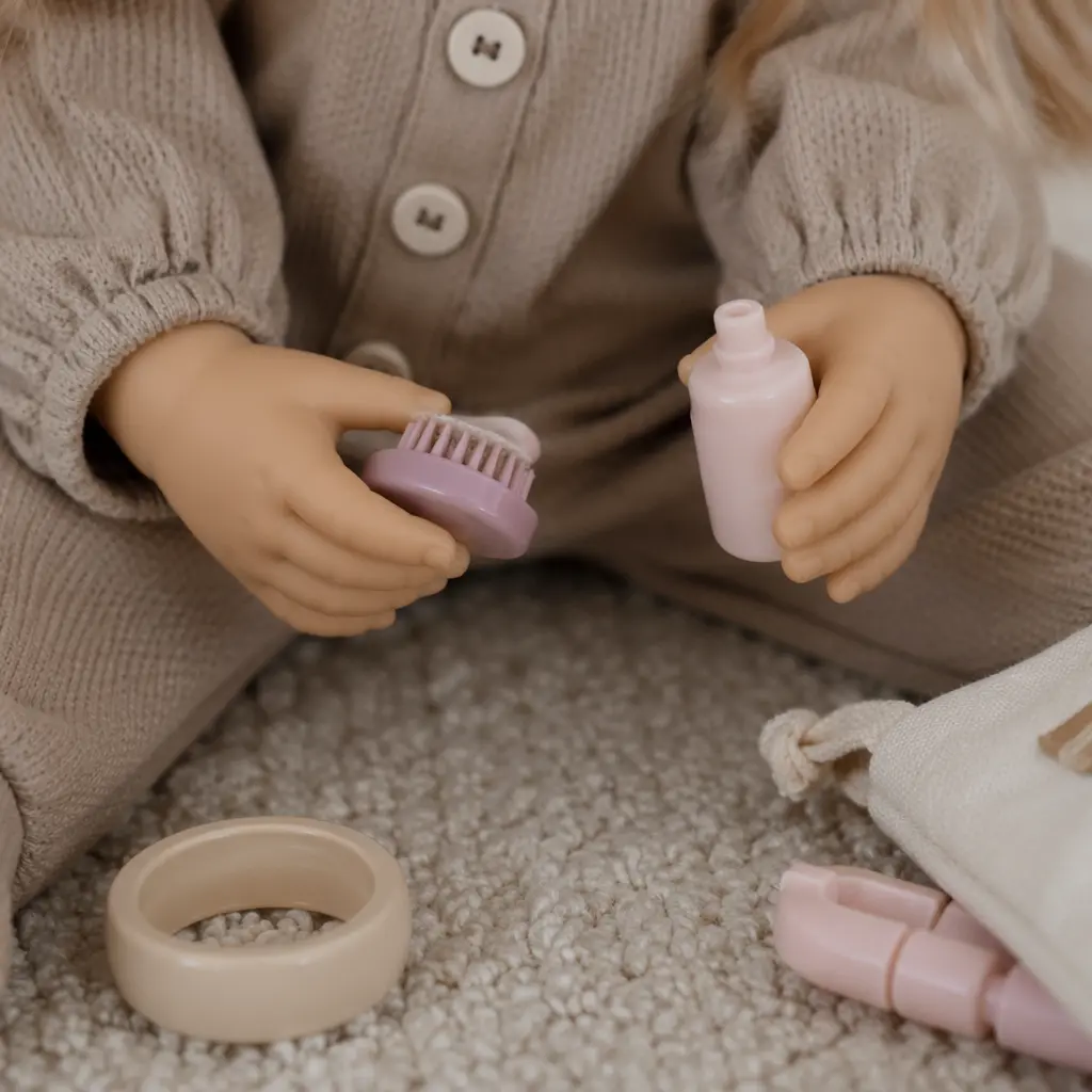 Close-up of doll accessories and interactive buttons without showing faces