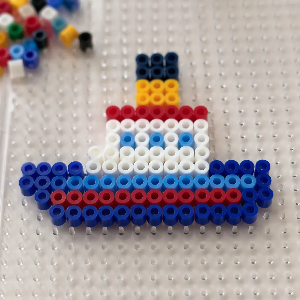 Colorful fuse beads arranged on a pegboard in a pixel-style design