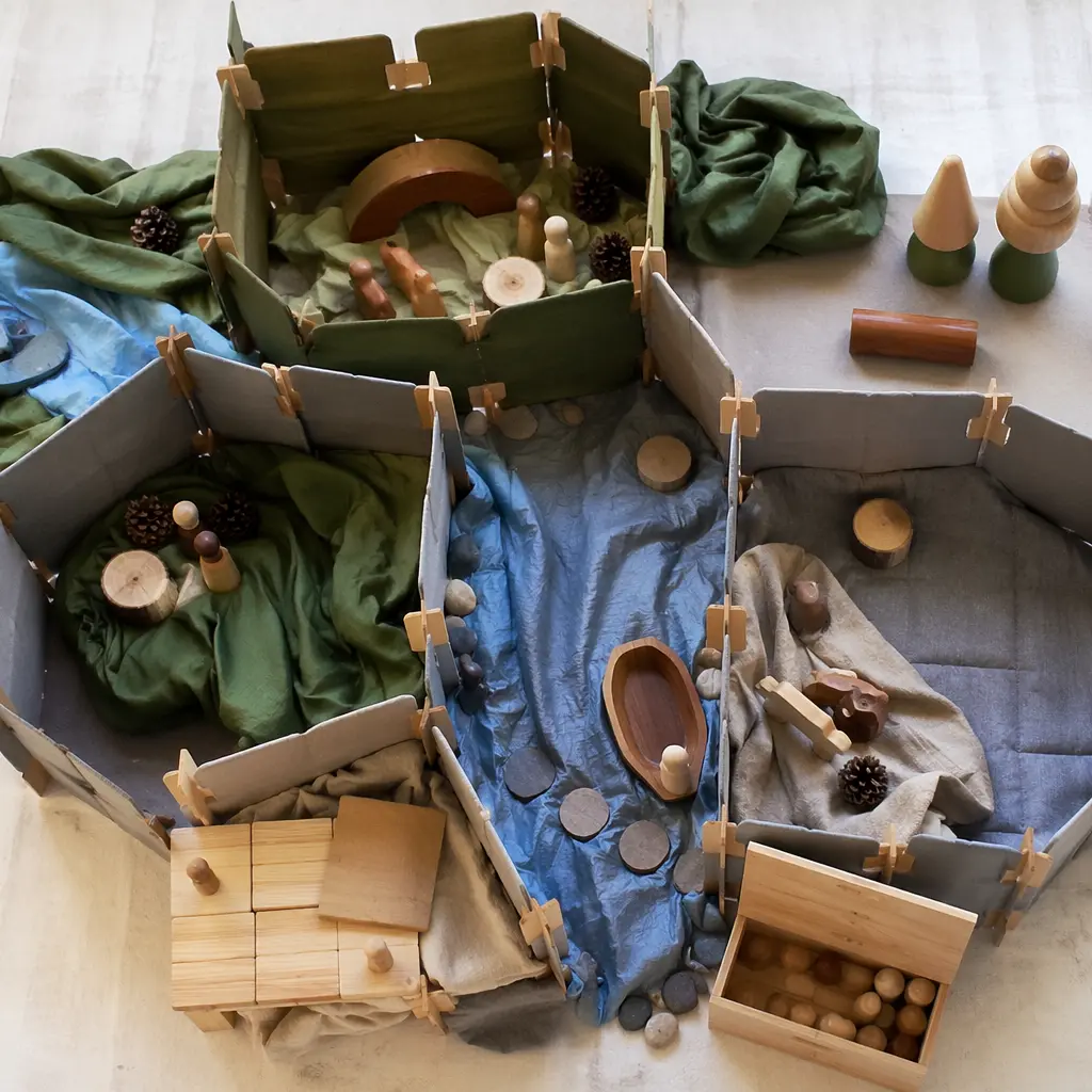 Modular pretend play materials arranged into a child-built scene
