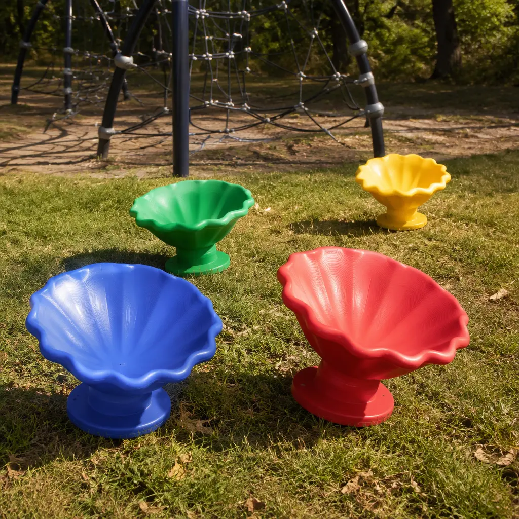 Several colorful open-ended spinning shell toys outdoors on grass