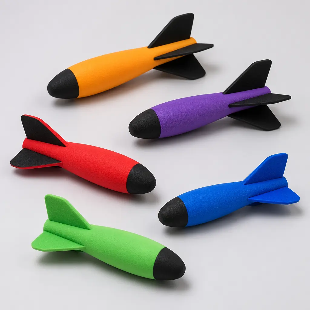 Colorful foam flying toys with finned tails displayed in a studio setting