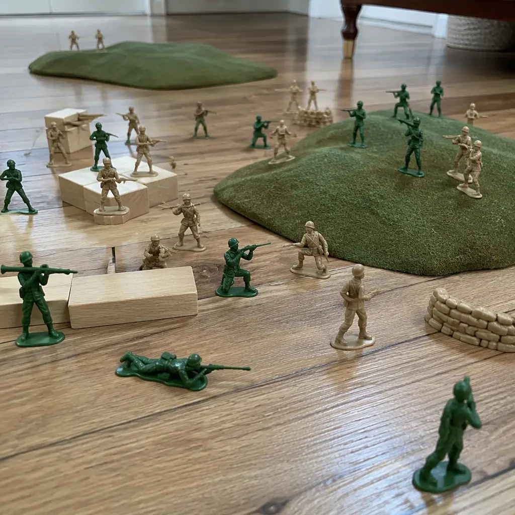 Plastic toy soldiers arranged in a miniature battlefield setting